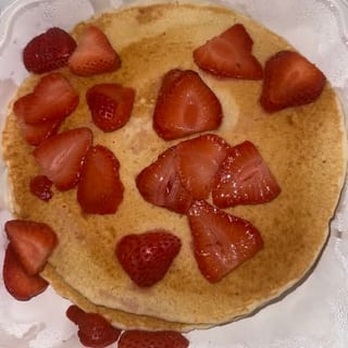 Two Pancakes with Strawberries and Whipped Cream