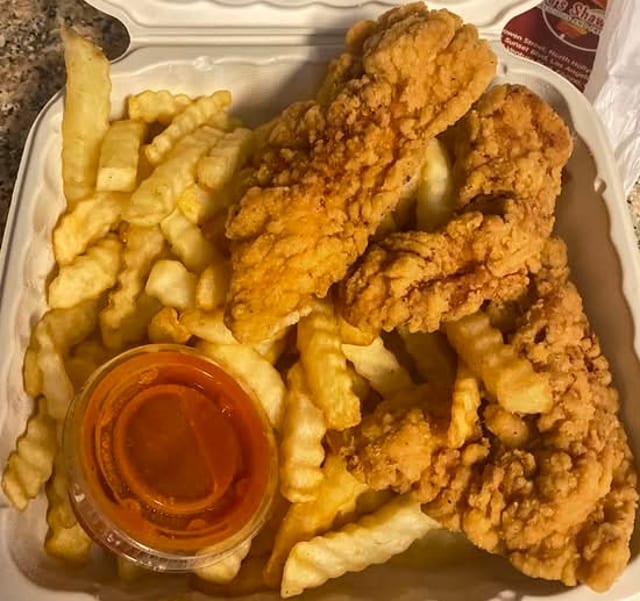 Chicken Strips with Fries & Sauce.